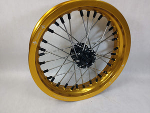 Woody's custom front wheel for Sur Ron e-bike in the 12" diameter, featuring gold rim, black hub and black spoke-nipples