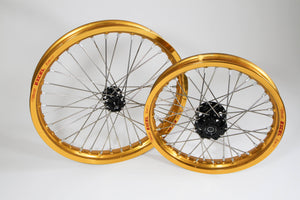 Woody's custom front and rear wheels for Sur Ron w/ gold Excel rims and black hubs