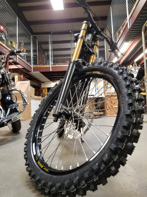 Woody's custom front wheel mounted on a Sur Ron e-bike