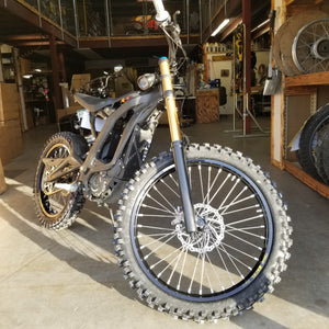 Woody's custom wheels mounted on a Sur Ron e-bike