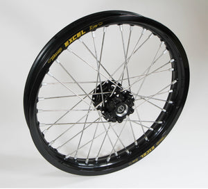 Woody's custom rear wheel for Sur Ron e-bike featuring black Excel rim w/ black billet hub.