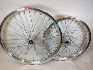 Woody's custom wheelset for Sur Ron e-bike featuring silver Excel rims w/ silver billet hubs.