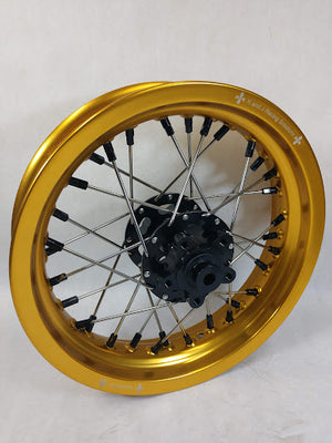 Woody's custom rear wheel for Sur Ron e-bike in the 12" diameter, featuring gold rim, black hub and black spoke-nipples
