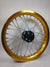 Woody's custom rear wheel for Sur Ron e-bike w/ gold Excel rim and black billet hub.