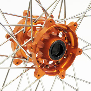 Close up of a KTM front wheel with Woody's billet Superlite hub anodized orange